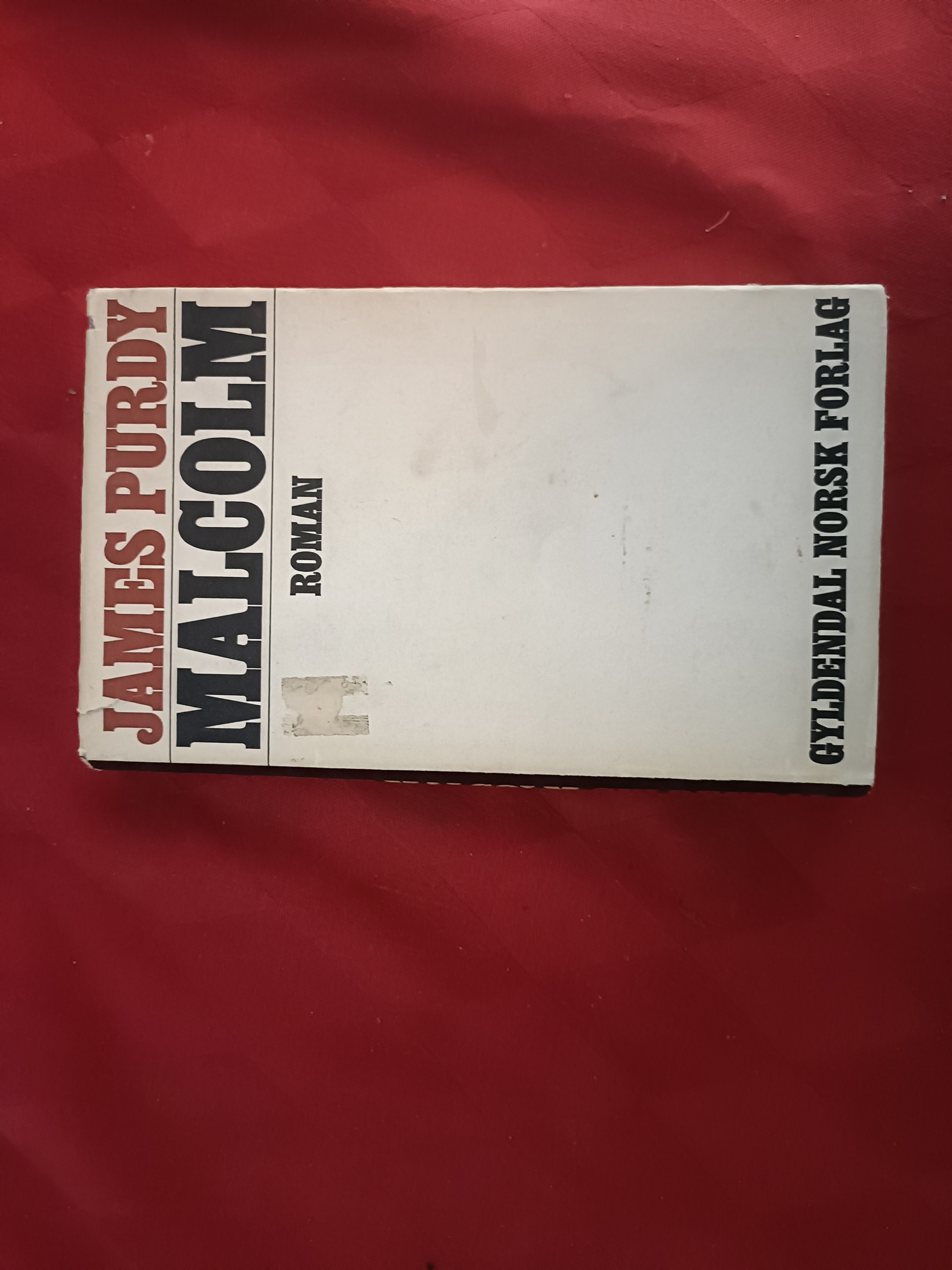 Malcolm. Oversatt av Colbjørn Helander
